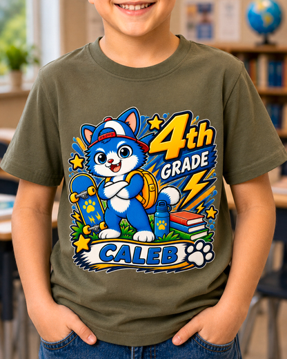 Child wearing a military green personalized fourth grade skater cat shirt with the sample name Caleb in a classroom.