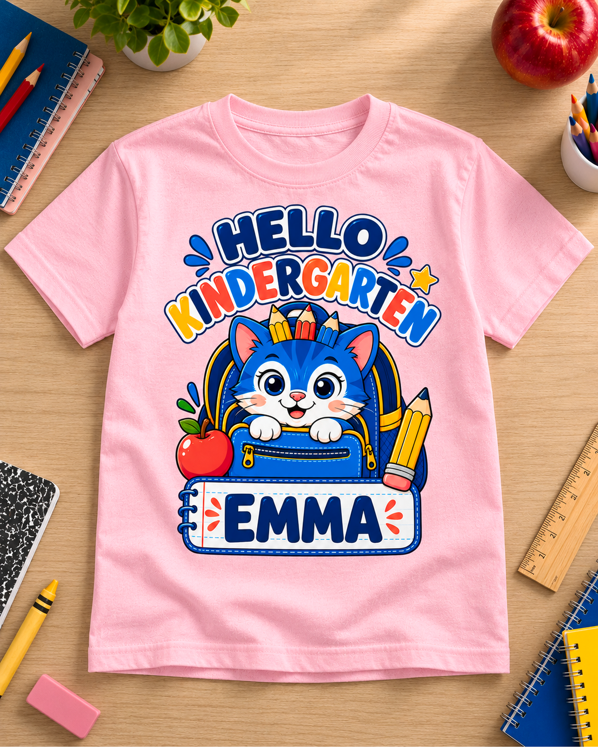 Light pink personalized kindergarten backpack cat youth shirt flat lay with the sample name Emma.