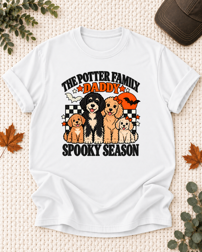 White Daddy T-shirt with four illustrated dogs, an orange moon, bats, black-and-cream checkerboard accents, and example family-name text.
