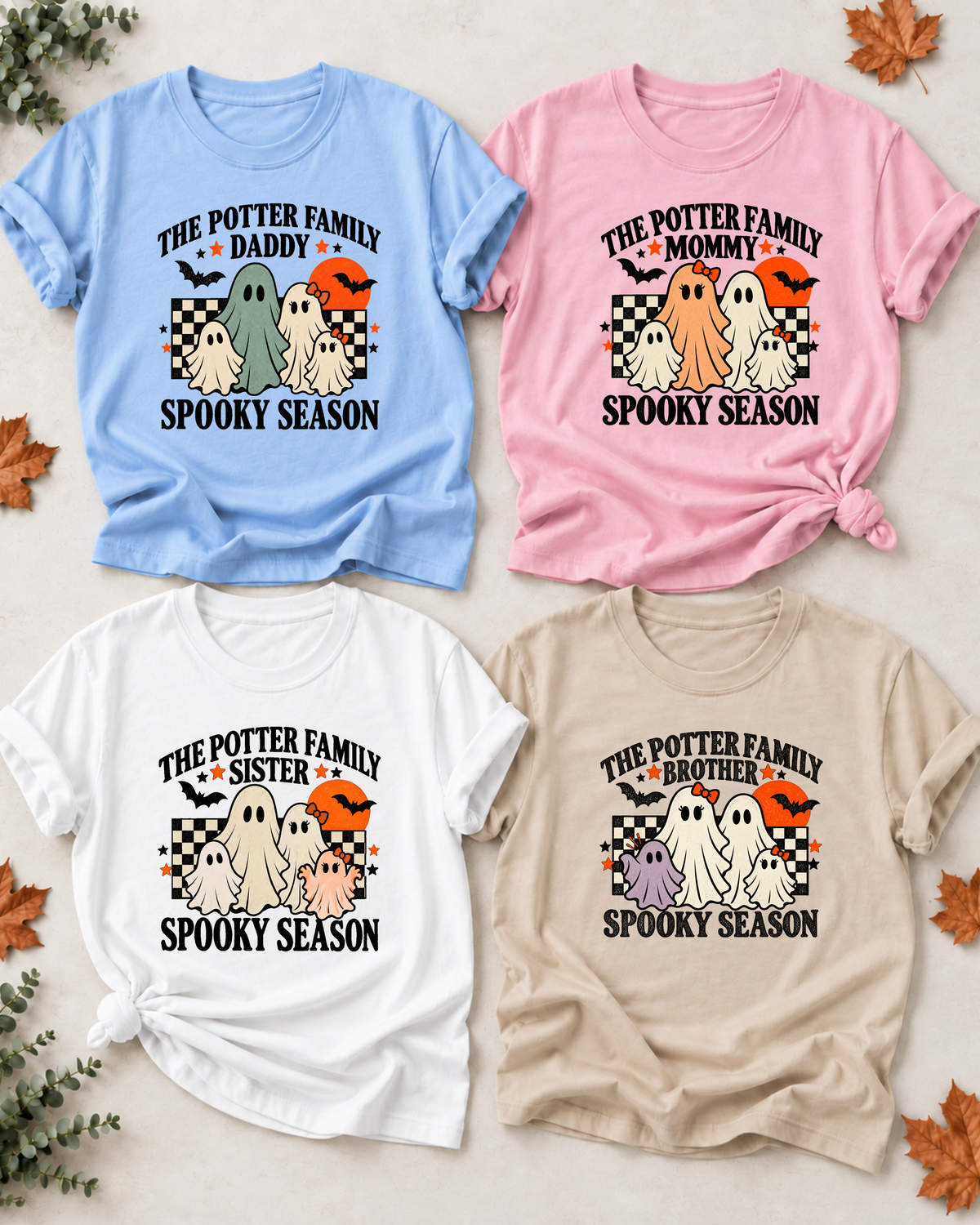Four Halloween family T-shirts with friendly ghosts: Daddy in light blue, Mommy in light pink, Sister in white, and Brother in sand, each showing example family-name text and Spooky Season lettering.