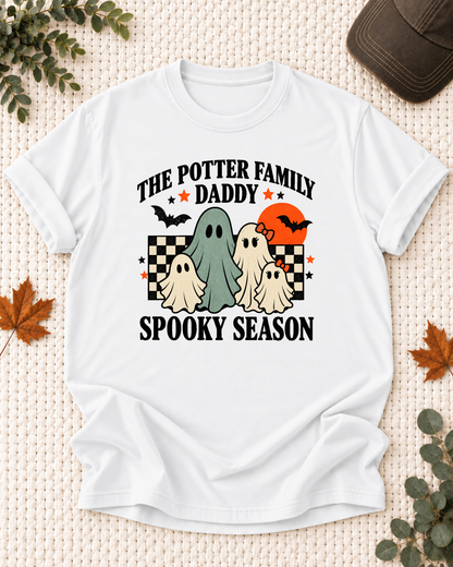 White Daddy T-shirt with friendly ghosts, an orange moon, bats, black-and-cream checkerboard accents, and example family-name text.
