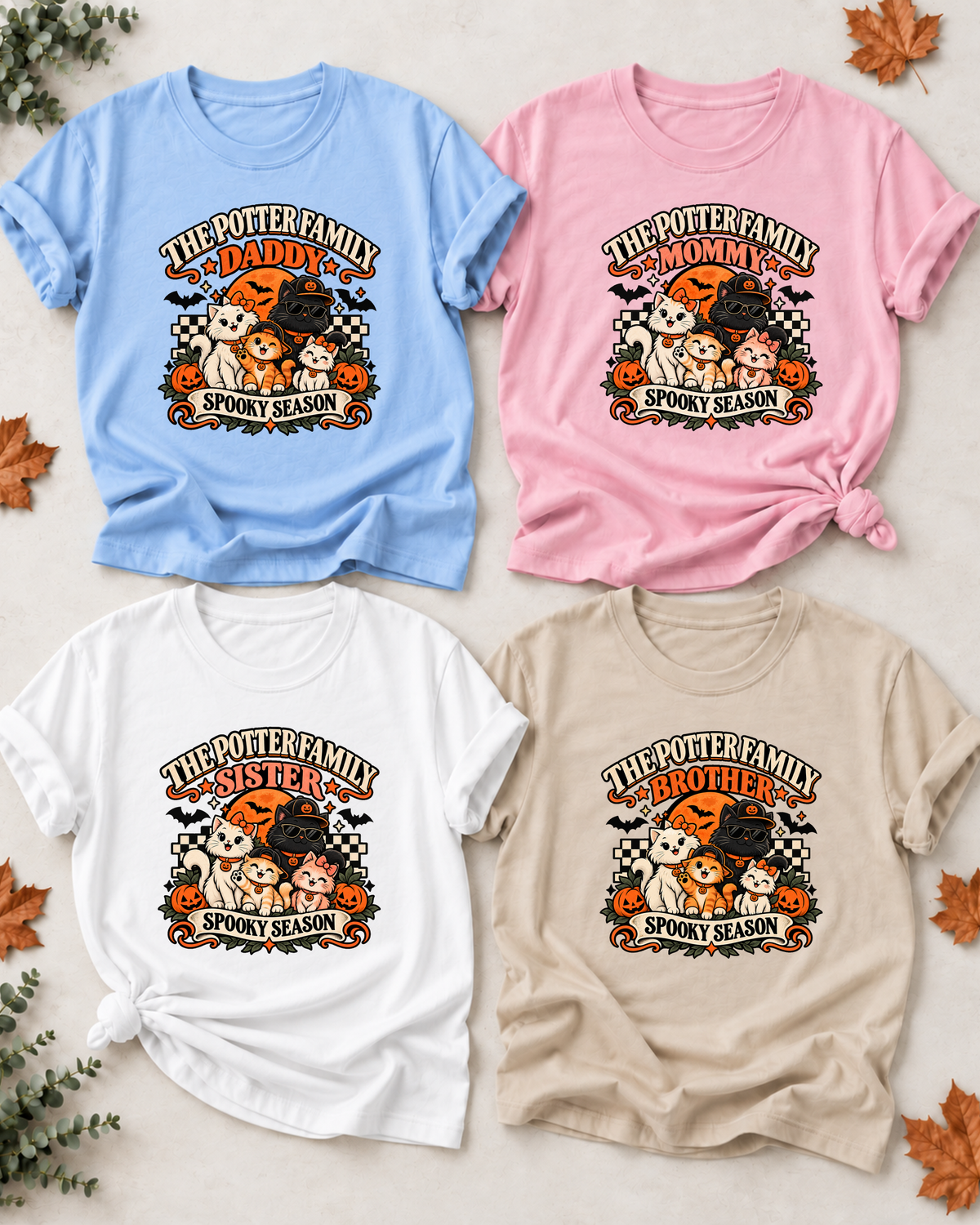 Four Halloween family T-shirts with costume-inspired cats: Daddy in light blue, Mommy in light pink, Sister in white, and Brother in sand, each showing example family-name text and Spooky Season lettering.