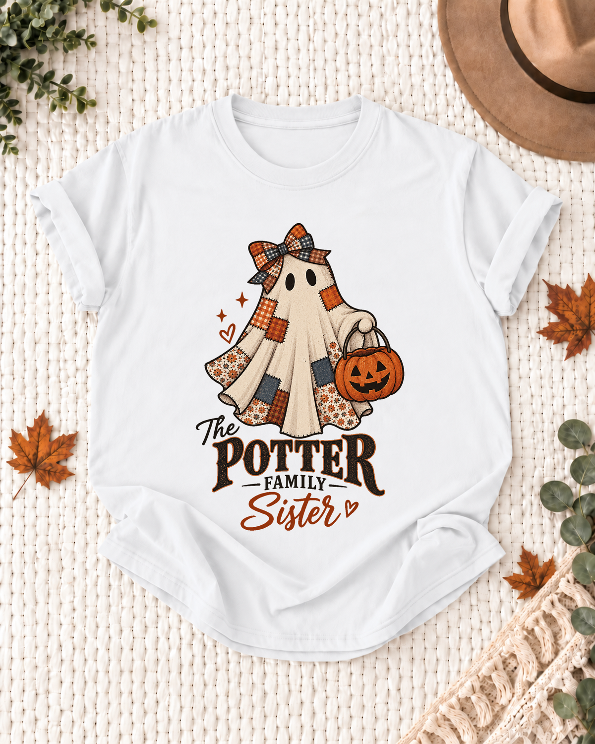 White Sister T-shirt with a patchwork ghost wearing a bow and scarf, holding a jack-o'-lantern, with example family-name text.