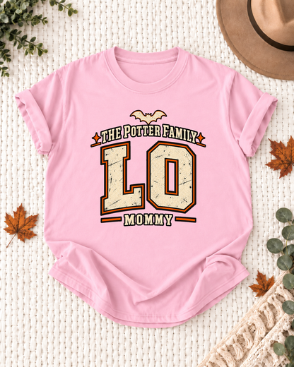Mommy's Light Pink personalized Halloween shirt mockup with the LO wordmark, the Mommy role label, and vintage letterman artwork.