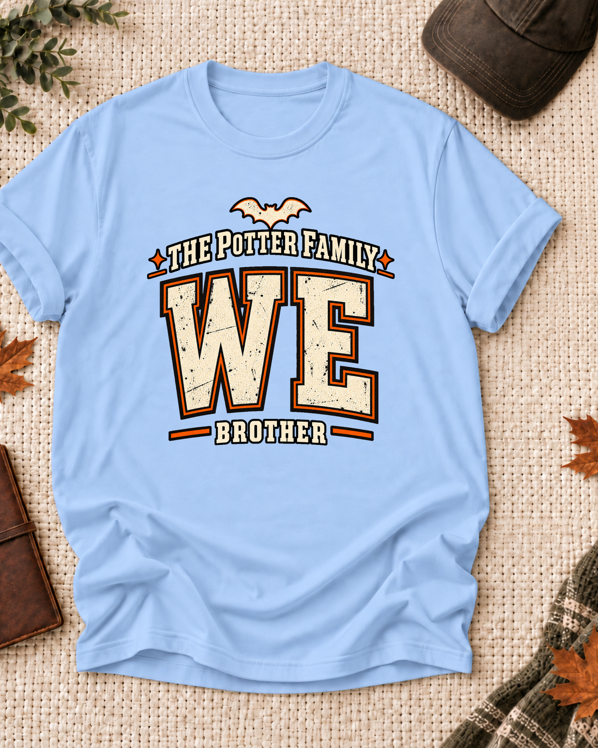 Brother's Light Blue personalized Halloween shirt mockup with the WE wordmark, the Brother role label, and vintage letterman artwork.