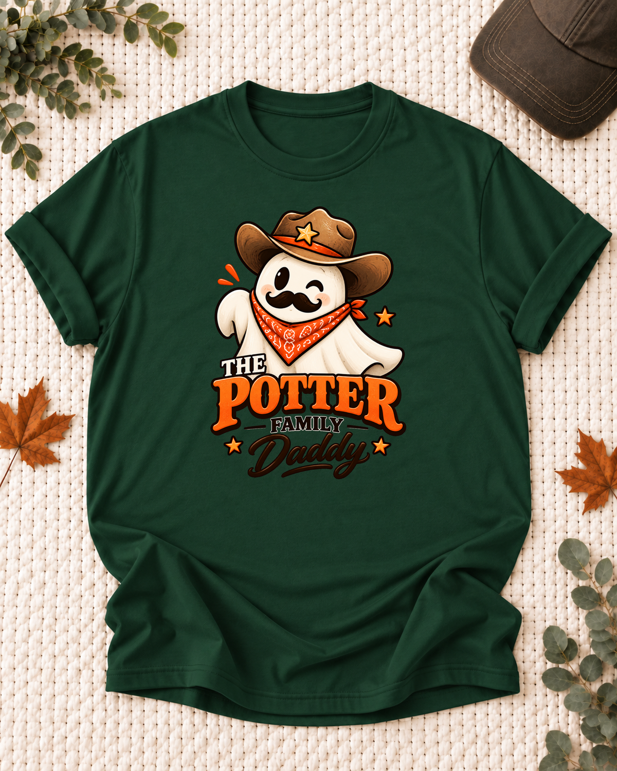 Daddy's Dark Green personalized Halloween shirt mockup with a western ghost with a cowboy hat, mustache, and bandana, sample family lettering, and the role label.