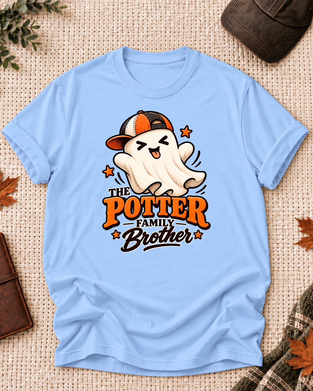 Brother's Light Blue personalized Halloween shirt mockup with a playful ghost in an orange cap with star accents, sample family lettering, and the role label.