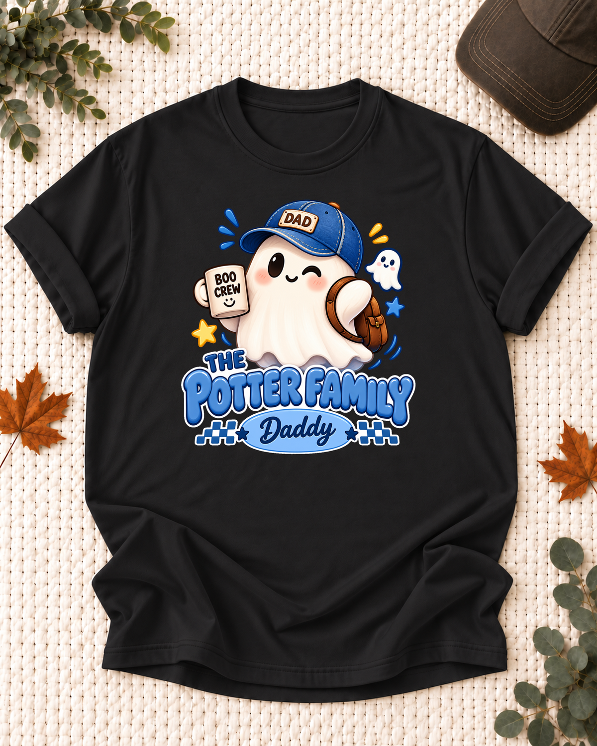 Daddy's Black personalized Halloween shirt mockup with a ghost with a blue cap, mug, and bag, sample family lettering, and the role label.