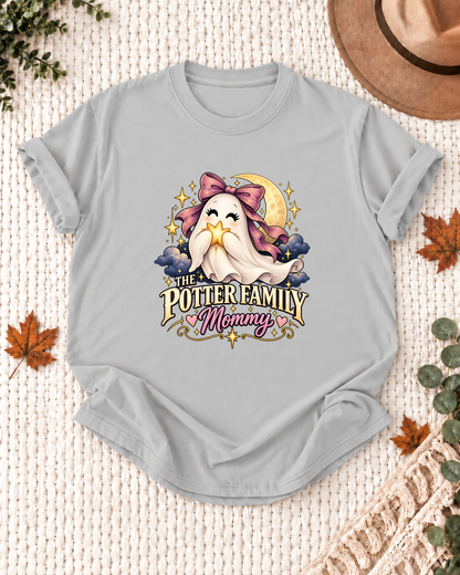Mommy's Ash Grey personalized Halloween shirt mockup with a ghost with a purple bow, star, and moon, sample family lettering, and the role label.
