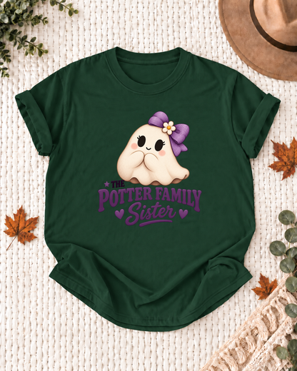 Sister's Dark Green personalized Halloween shirt mockup with a rounded ghost with a purple bow and purple lettering, sample family lettering, and the role label.