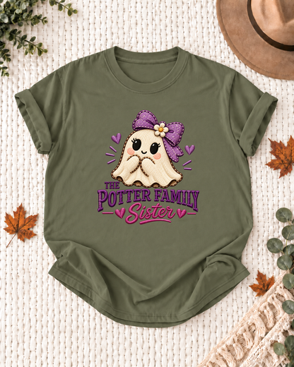 Sister's Olive personalized Halloween shirt mockup with a stitched-look ghost with a purple bow, flower, and hearts, sample family lettering, and the role label.