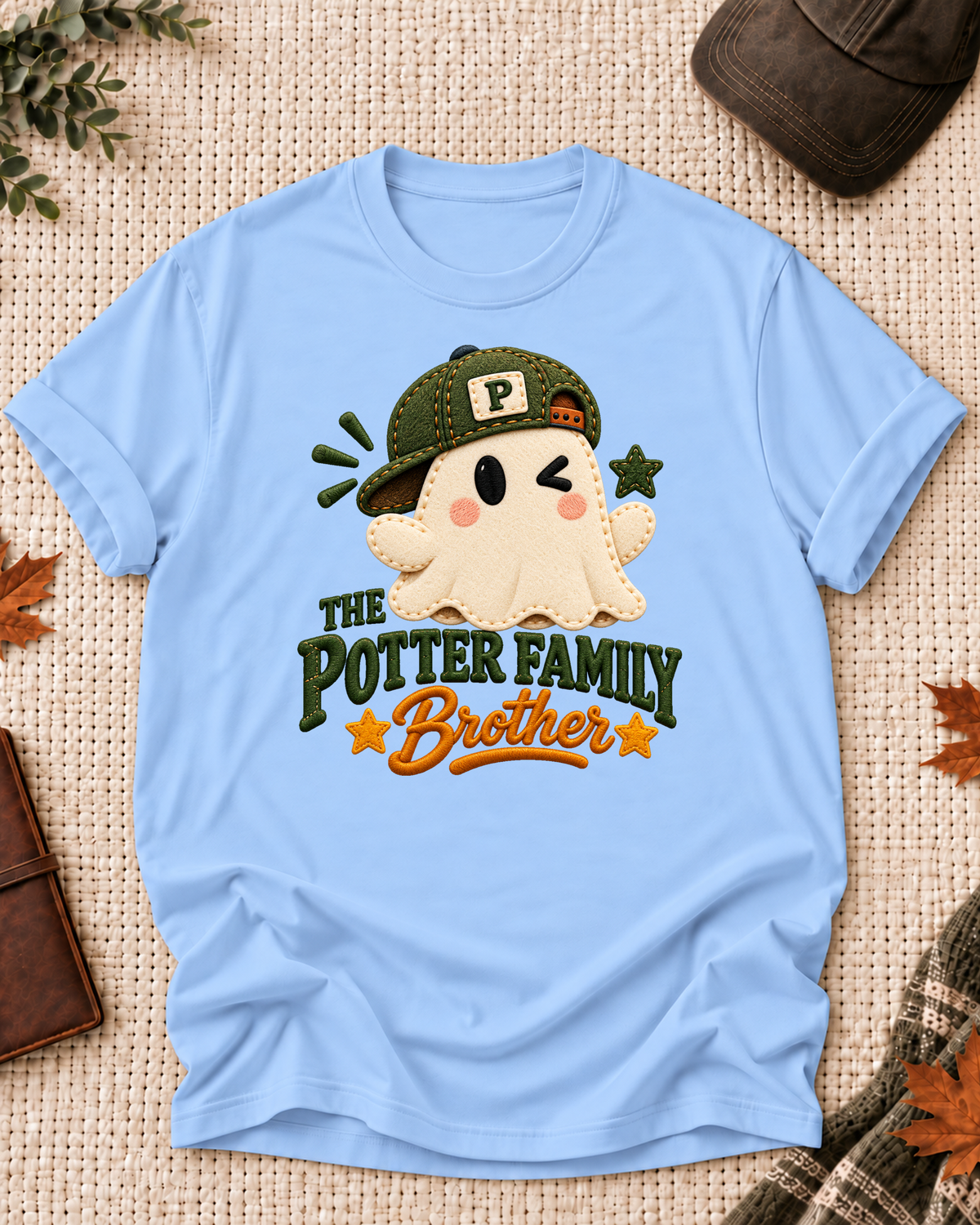 Brother's Light Blue personalized Halloween shirt mockup with a patchwork-style ghost with an olive cap and mustard stars, sample family lettering, and the role label.