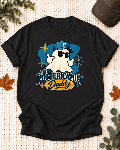 Daddy's Black personalized Halloween shirt mockup with a mid-century ghost with a teal cap, sunglasses, and blue field, sample family lettering, and the role label.