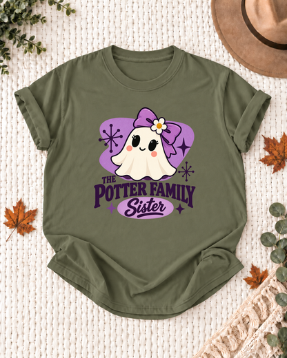 Sister's Olive personalized Halloween shirt mockup with a mid-century ghost with a purple bow, purple field, and starbursts, sample family lettering, and the role label.