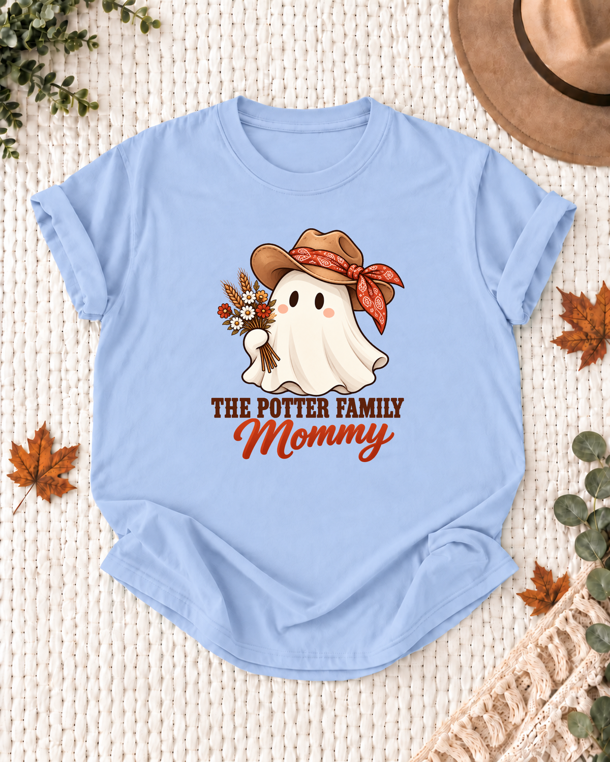 Mommy's Light Blue personalized Halloween shirt mockup with a rodeo ghost with country accessories, sample family lettering, and the role label.