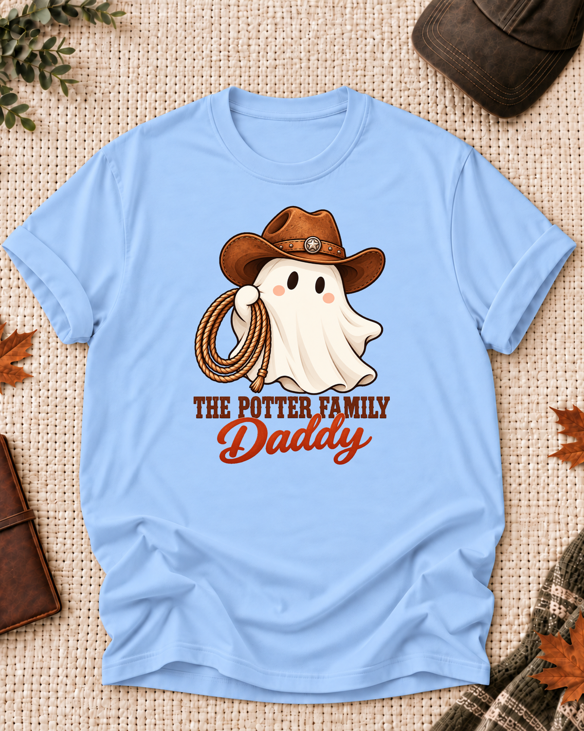 Daddy's Light Blue personalized Halloween shirt mockup with a cowboy-hat ghost with rodeo details, sample family lettering, and the role label.