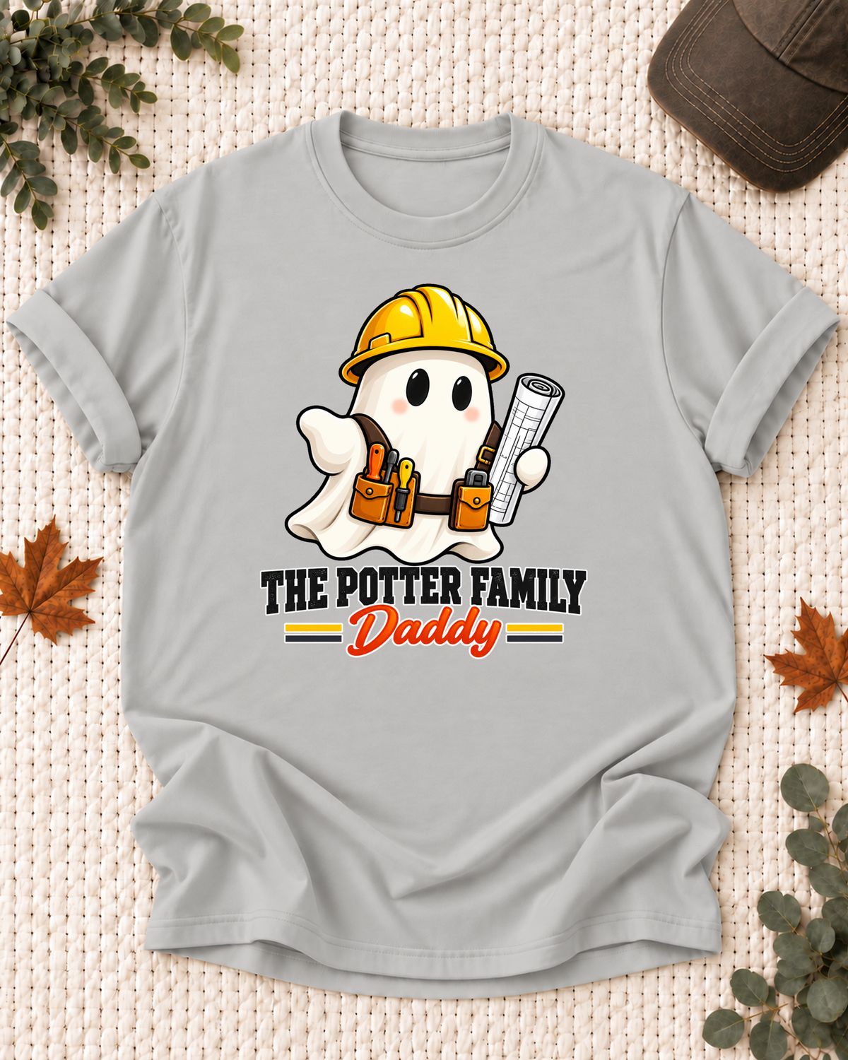 Daddy's Ash Grey personalized Halloween shirt mockup with a construction ghost with a hard hat and work tools, sample family lettering, and the role label.