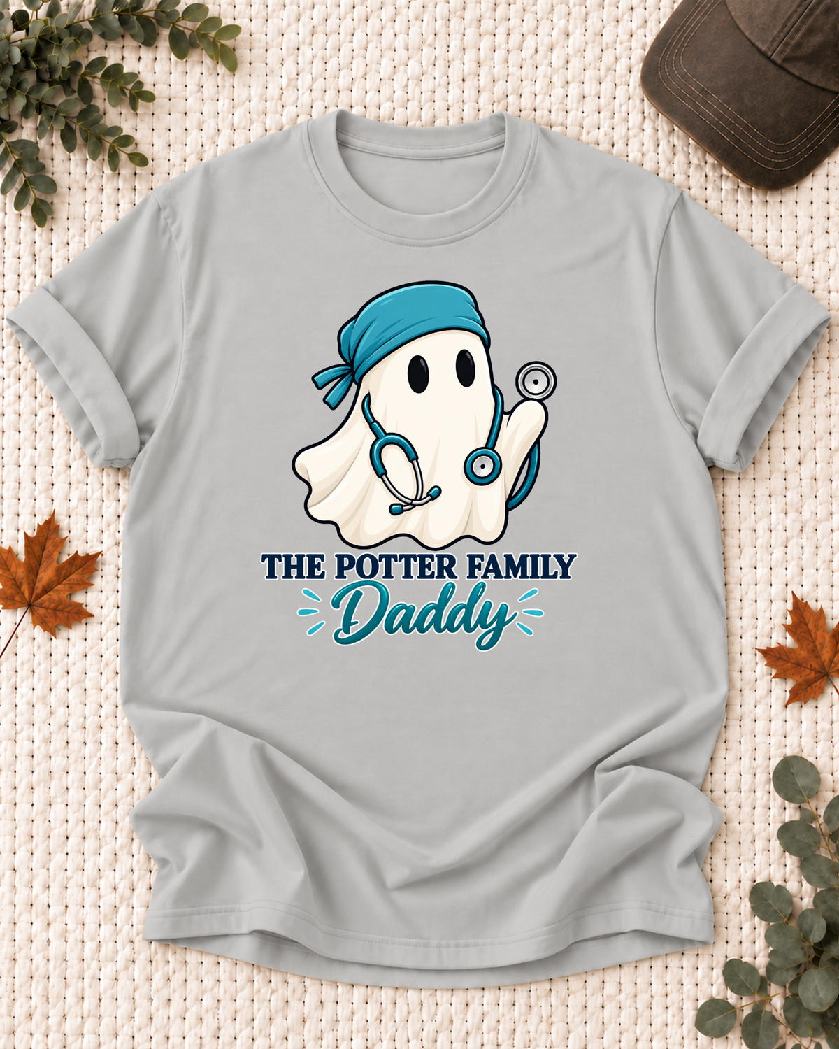 Daddy's Ash Grey personalized Halloween shirt mockup with a healthcare ghost with a scrub cap and clinical details, sample family lettering, and the role label.