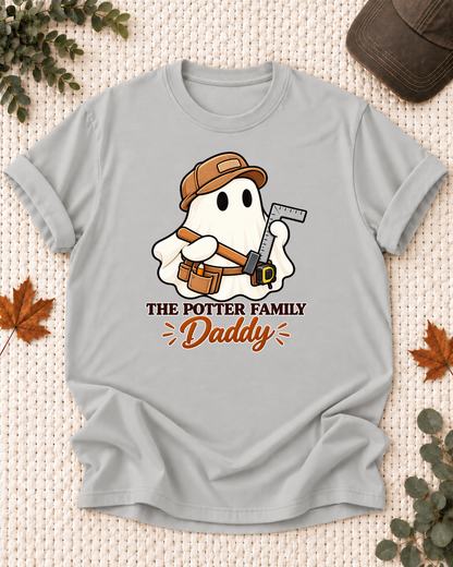 Daddy's Ash Grey personalized Halloween shirt mockup with a carpenter ghost with a saw and tool belt, sample family lettering, and the role label.