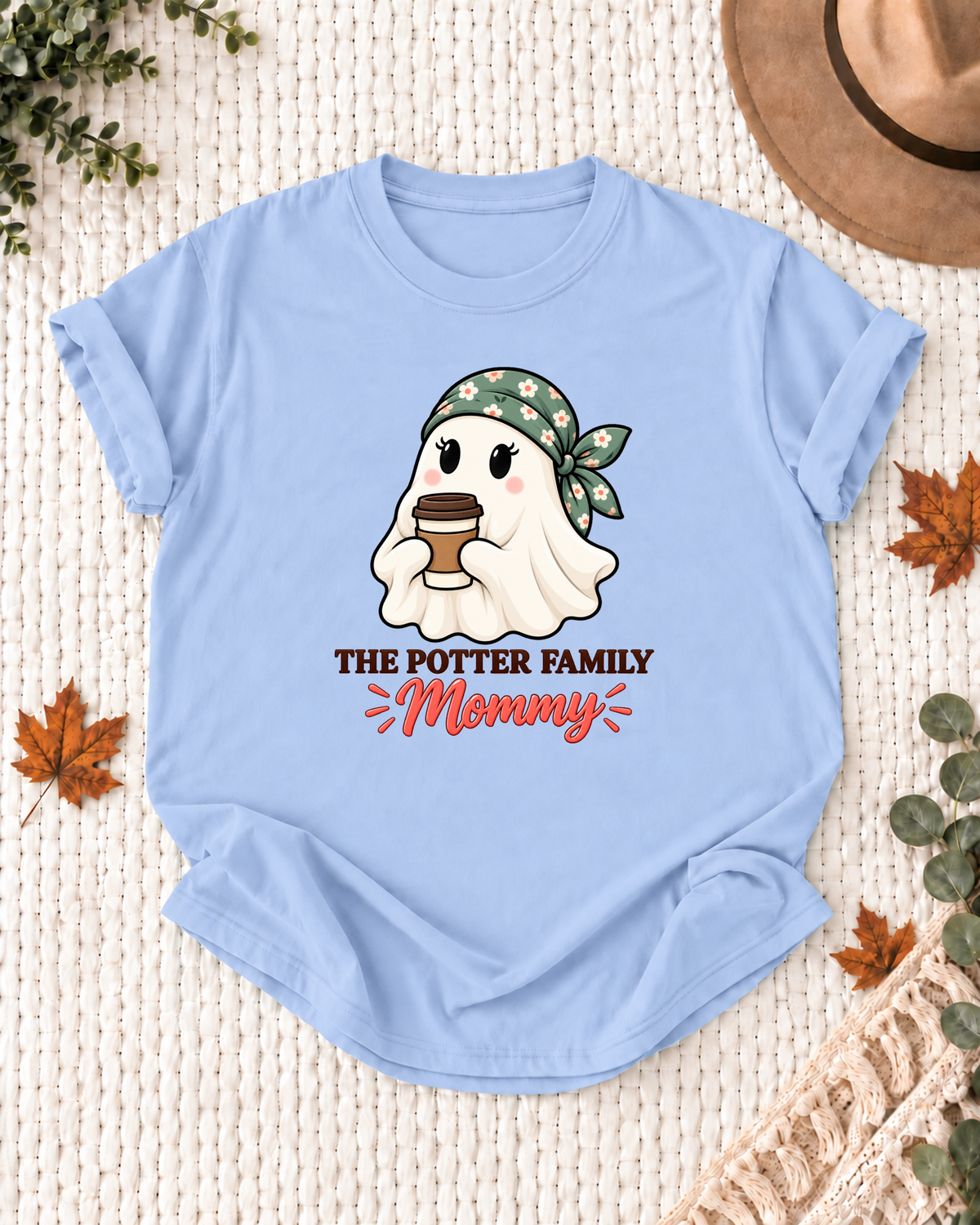 Mommy's Light Blue personalized Halloween shirt mockup with a coffee ghost with a takeaway cup, sample family lettering, and the role label.