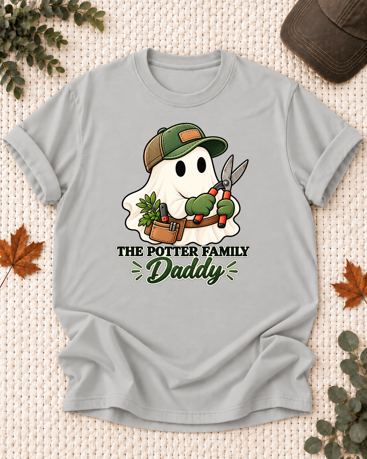 Daddy's Ash Grey personalized Halloween shirt mockup with a garden ghost with pruning shears, sample family lettering, and the role label.