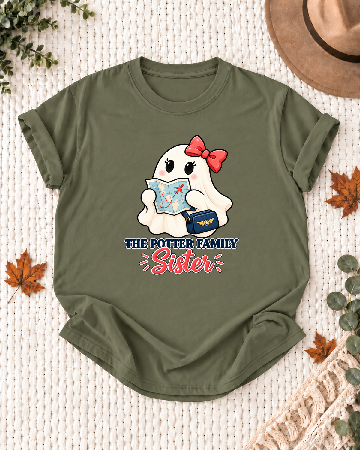 Sister's Olive personalized Halloween shirt mockup with a pilot ghost with a shoulder bag and aviation accents, sample family lettering, and the role label.