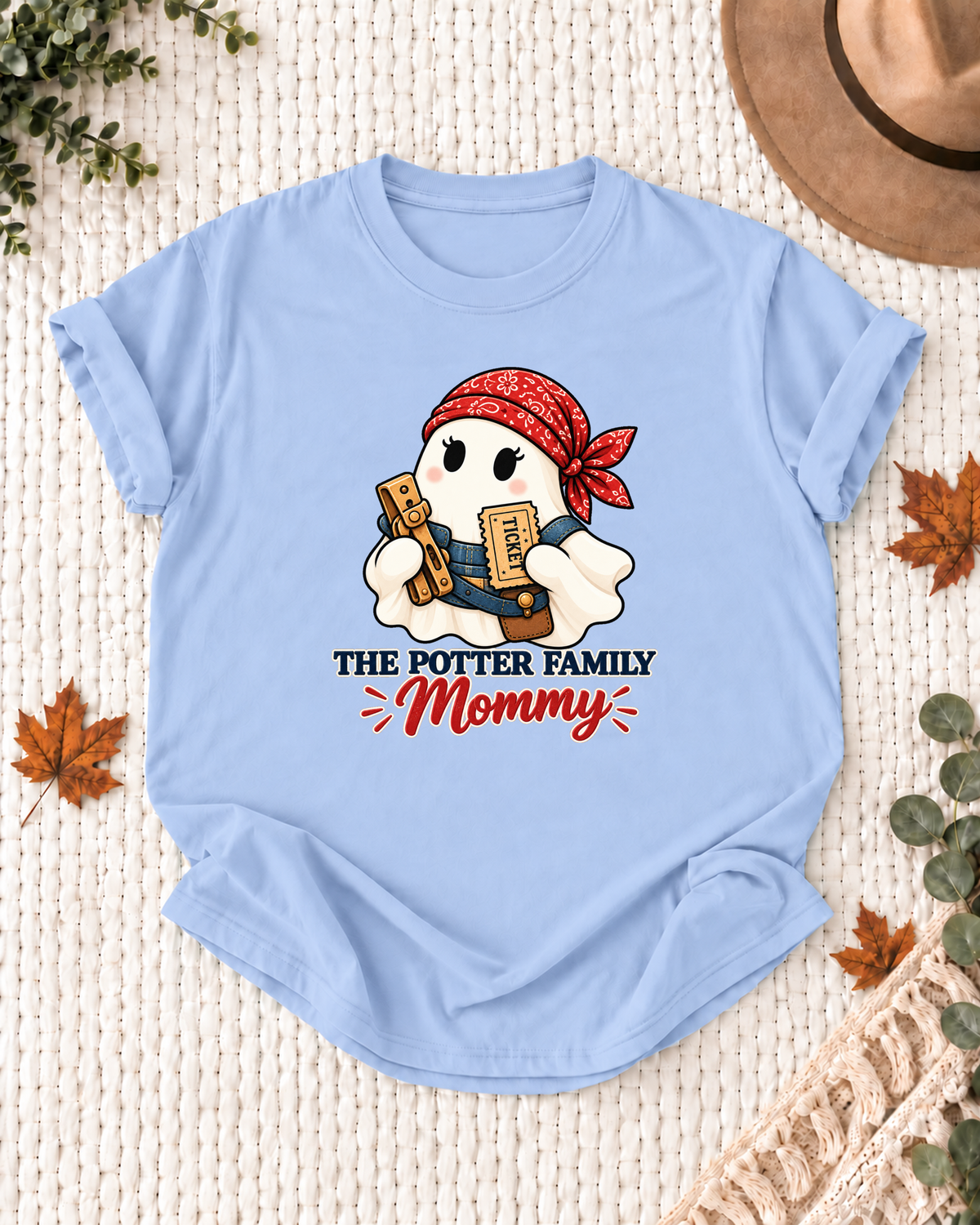 Mommy's Light Blue personalized Halloween shirt mockup with a train conductor ghost with engineer-cap details, sample family lettering, and the role label.