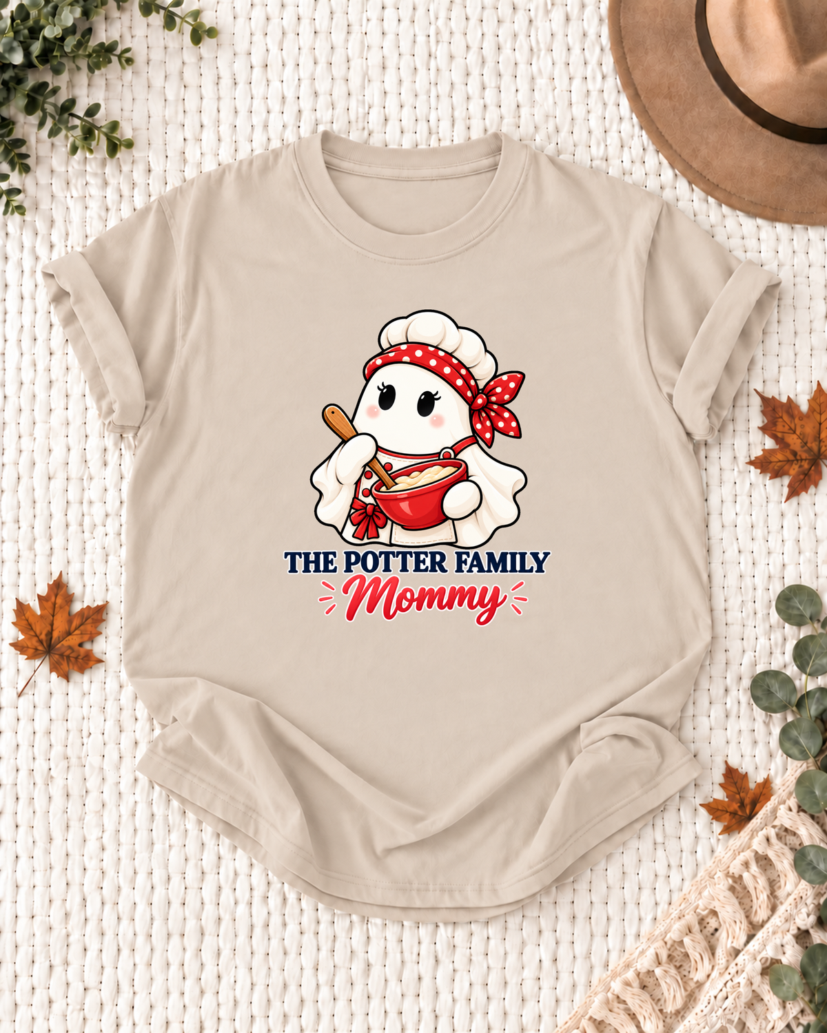 Mommy's Sand personalized Halloween shirt mockup with a chef ghost with chef hat and mixing bowl, sample family lettering, and the role label.