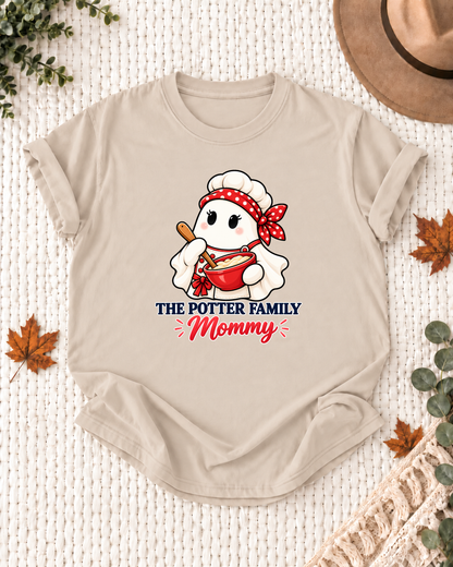 Mommy's Sand personalized Halloween shirt mockup with a chef ghost with chef hat and mixing bowl, sample family lettering, and the role label.