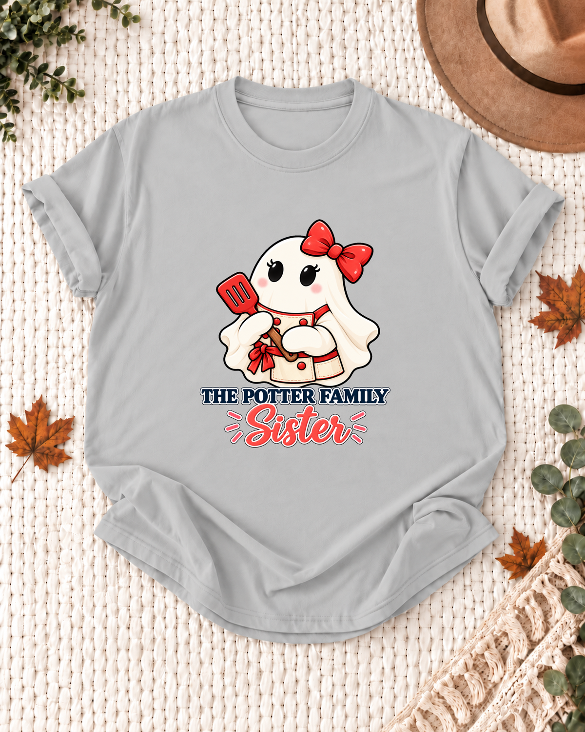 Sister's Ash Grey personalized Halloween shirt mockup with a chef ghost with a spatula and kitchen details, sample family lettering, and the role label.