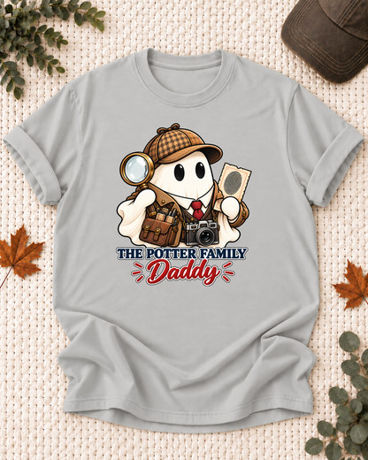 Daddy's Ash Grey personalized Halloween shirt mockup with a detective ghost with camera and evidence-notebook accents, sample family lettering, and the role label.